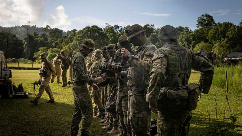 Australian Army soldiers from 1st Battalion, the Royal Australian Regiment, conduct a clearance before a live-fire activity at Tully training area in Queensland. 