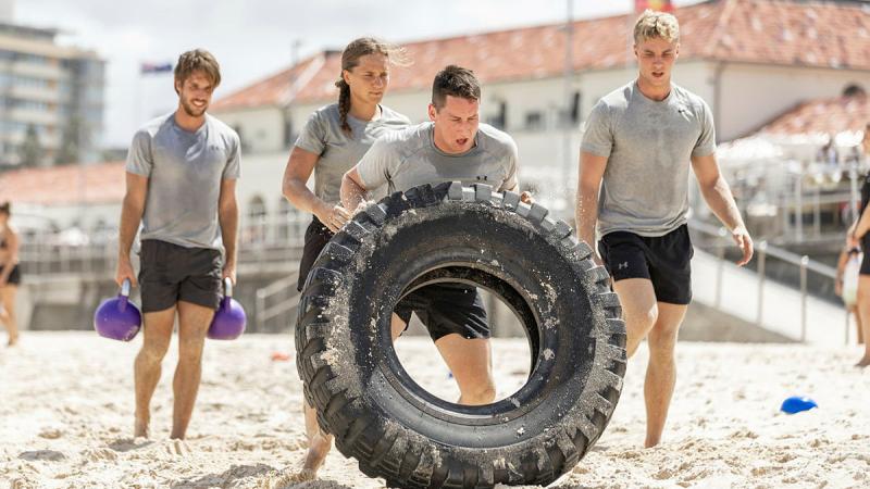 Clearance diver trainees push themselves during a boot camp session as part of SailGP's pre-race activities at Bondi Beach, Sydney. 