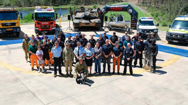 Personnel from the Army and Queensland police, ambulance, fire and emergency services, and other attendees with their vehicles at the Run Army 2024 launch held at Gallipoli Barracks, Enoggera.