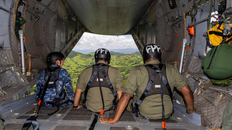 RAAF Flight Lieutenant Imogen Lunny, left, with Republic of Fiji Military Forces Captain Robert Browne and Warrant Officer Class One Waisake Kadonavatu, during their flight in a C-27J Spartan over Fiji.