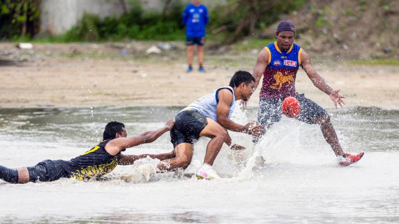Local participants take part in an AFL practise match during an ADF coaching course at Linkbelt Oval, Yangor, Nauru. Photos: Leading Seaman Matthew Lyall