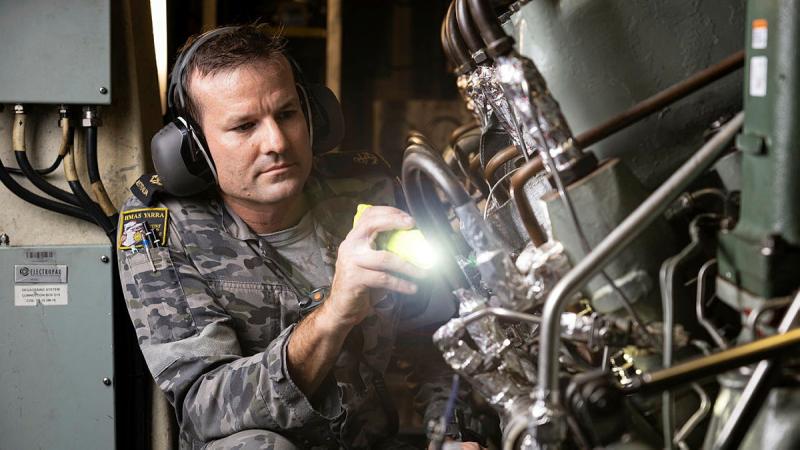 Leading Seaman Marine Technician Andre Vink in the engine room of HMAS Yarra. 