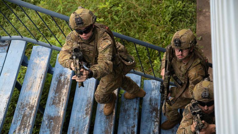 Australian Army soldiers from 3rd Battalion, The Royal Australian Regiment during an urban operations exercise at the disused Stuart State School in Townsville. Non-lethal training ammunition was used for the activity against enemy role players who had occupied the school which needed to be cleared by friendly forces.
