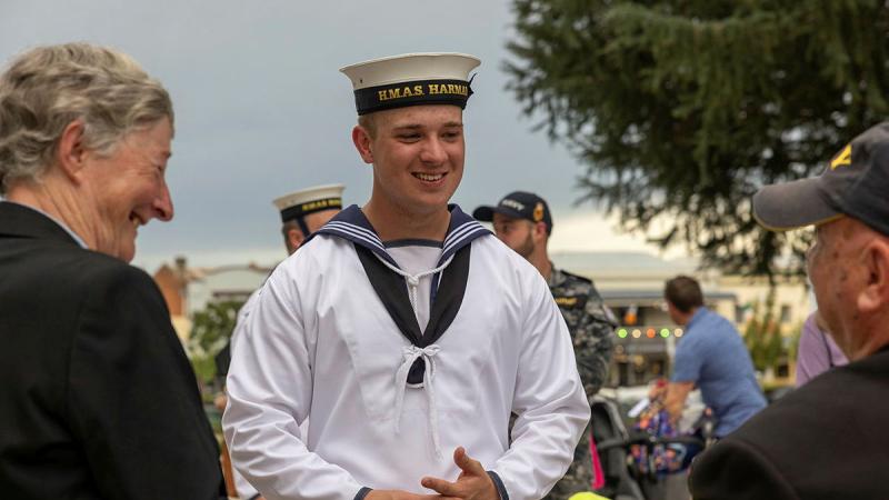 Navy gap year sailor Seaman Ross Hunter chats with veterans in Bathurst during HMAS Harman's Navy Week tour of the Central West, NSW. 