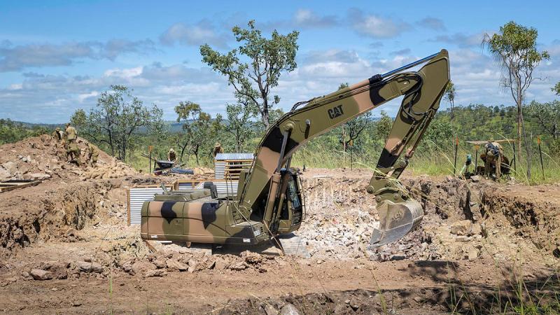 Soldiers from 3rd Combat Engineer Regiment use an excavator to construct a bunker during Exercise Brolga Walk at Townsville Field Training Area, Queensland. Photo: Trooper Dana Millington
