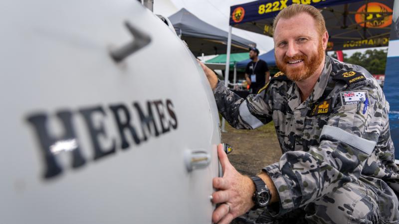 Chief Petty Officer David Dillon with the Schiebel S-100 Camcopter "Hermes" during the Airshows Downunder Shellharbour at Shellharbour Airport Career Day