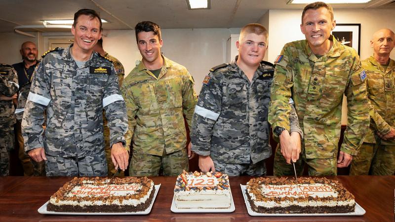 From left, Commanding Officer of HMAS Stuart, Commander Richard Raymond, Sapper Sean Egan-Richards, Seaman Thomas Brum and Australian Defence Adviser to Fiji, Army Colonel Henry Stimson cut the 123rd birthday for cakes Navy and Army in the Wardroom of HMAS Stuart whilst at anchor in Suva, Fiji. 