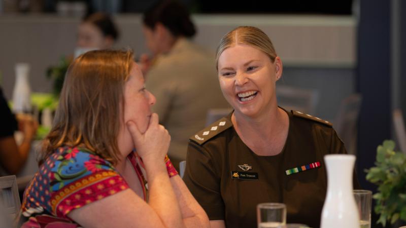 Australian Army officer Captain Pamela Truscott speaks with a fellow guest at the Working Spirit/RSL Western Australia International Women's Day lunch on Friday 1 March 2024.