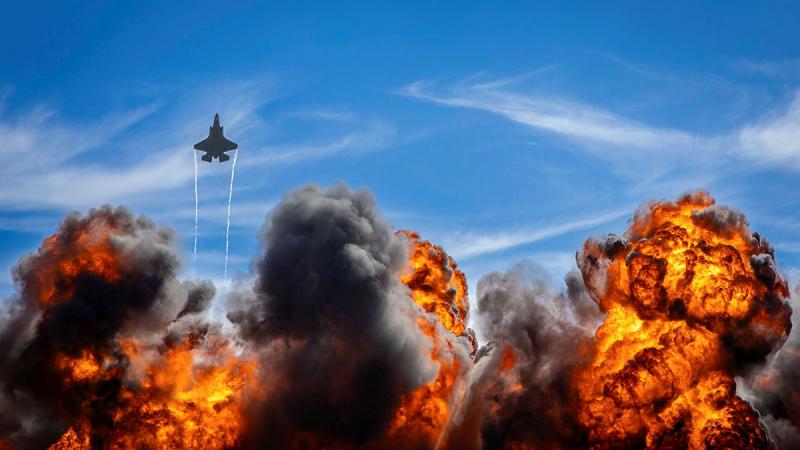 A RAAF F-35A Lightning II aircraft flies over the wall of fire during the Airshows Downunder Shellharbour 2024 at Shellharbour Airport. 