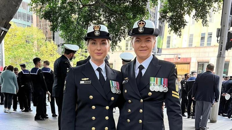 Royal Australian Navy sailors Chief Petty Officer Elisabeth Hudson (L) and her wife Petty Officer Emily Pyke, on Anzac Day 2023.