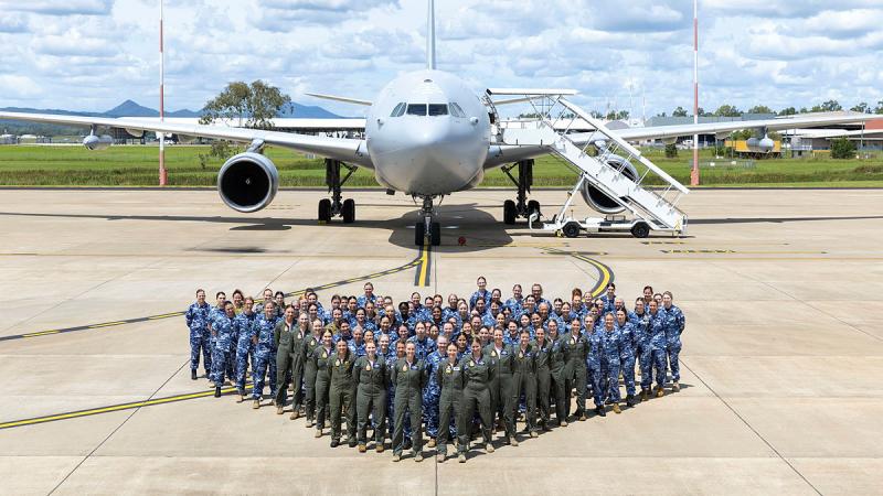 The all-female crew from 33 Squadron and ADF passengers gather for International Women's Day at RAAF Base Amberley.