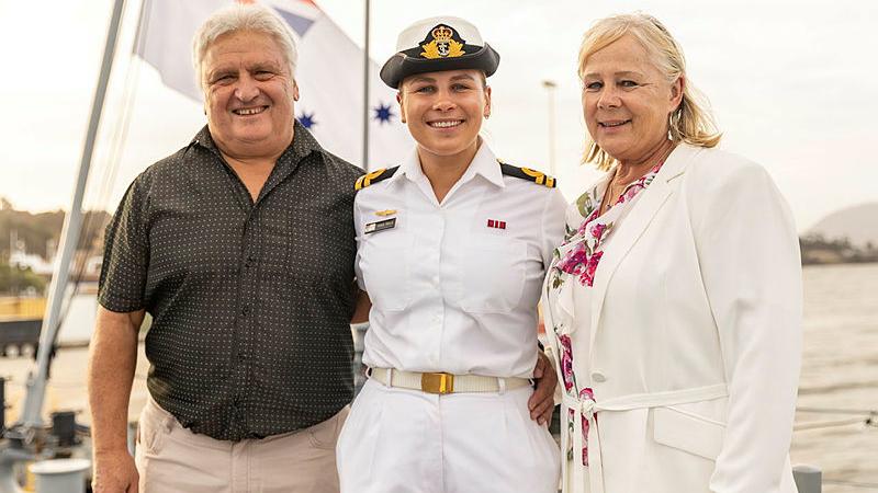 Lieutenant Renee Brelis with her parents on board HMAS Hobart in Tasmania. 