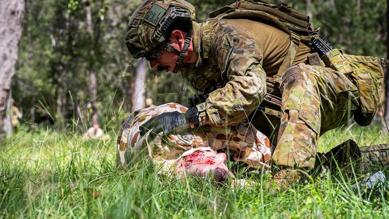 An Army medic from 2nd Health Battalion gives emergency medical care to simulated casualties during Exercise Viper Walk. 