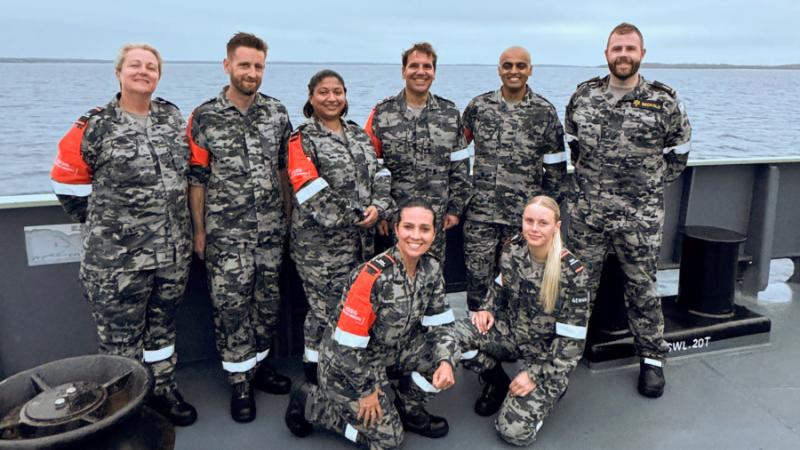 Able Seaman Harley Seckold, right, with APS representatives from Naval Shipbuilding and Sustainment Group and Navy on board MV Sycamore during Exercise Immerse.