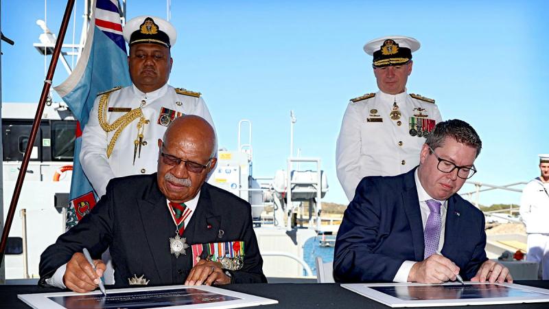 The Republic of Fiji Prime Minister Sitiveni Rabuka co-signs a certificate with Minister for International Development and the Pacific Pat Conroy, Chief of Navy Vice Admiral Mark Hammond and Chief of Navy of the Republic of Fiji Navy Commodore Humphrey Tawake at the handover of the ninetieth Guardian-class patrol boat at HMAS Stirling, WA. Photo: Chief Petty Officer Nina Fogliani