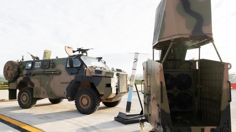 A Bushmaster protected mobility vehicle and a CEATAC System on display.