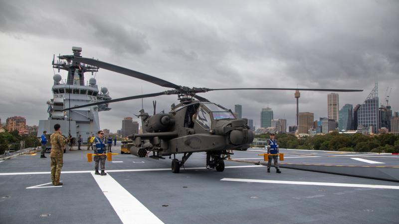 A US Army AH-64E Apache aboard HMAS Canberra while alongside at Fleet Base East in Sydney.