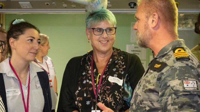 Navy Commander Steven Grosser from Fleet Health Division chats with Royal North Shore Hospital health managers Diane Elfleet and Bethany Lloyd.