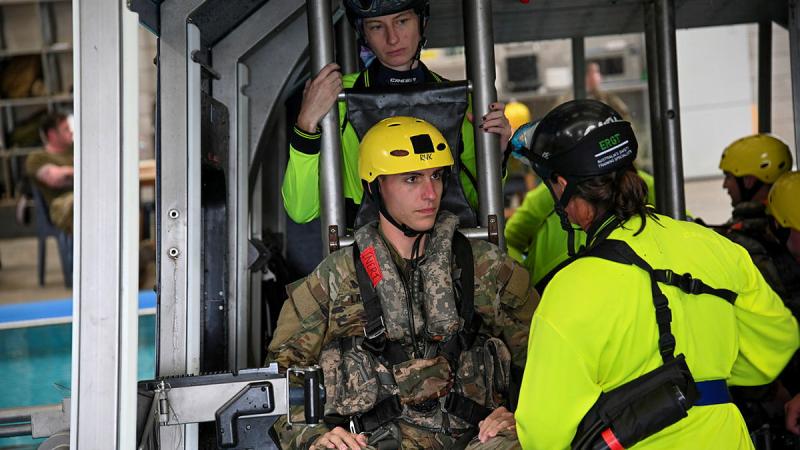 ERGT personnel brief US Army’s First Lieutenant Jacob Lamar on escape drills during Helicopter Underwater Escape Training.