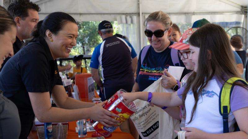 Defence Member and Family Support (DMFS) staff hand out welcome packs during the DMFS welcome event held at Sydney Zoo, NSW.