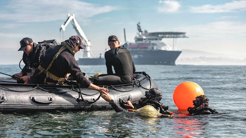 Dive team members from Australian Clearance Diving Team One prepare to conduct a mine countermeasure during Exercise Dugong at Eden, NSW. 
