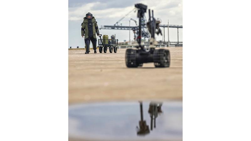 Chief Petty Officer Thomas Buchanan from Australian Clearance Diving Team Four prepares to go down range with a Talon Bomb Disposal Robot to conduct an improvised explosive device disposal scenario during the exercise.