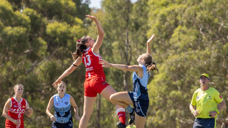 Two players from the Army and the Air Force jump to contest the ball during the ADF Australian Rules Football Carnival in Melbourne. Photo: Corporal Jonathan Goedhart