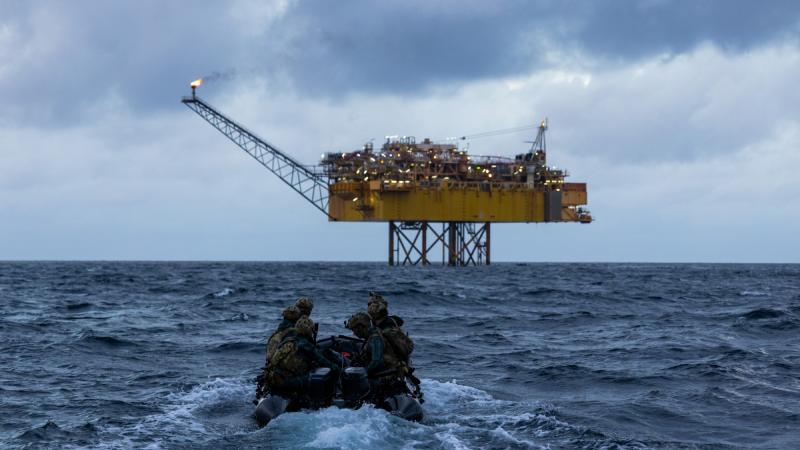 Army soldiers from Special Operations Command pilot a Zodiac small boat to offshore energy infrastructure in the Bass Strait during Exercise Iron Atlantis. (Imagery has been altered for security reasons.) 
