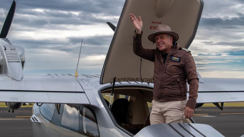 Michael Smith, 2016 Adventurer of the Year, waves from the hatch of his plane before he sets off to recreate the first circumnavigation by air of Australia.