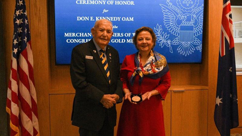 Merchant Navy veteran Don Kennedy receives the Merchant Mariners of WW2 Congressional Gold Medal from US Consul General Christine Elder at a ceremony in Sydney, NSW.