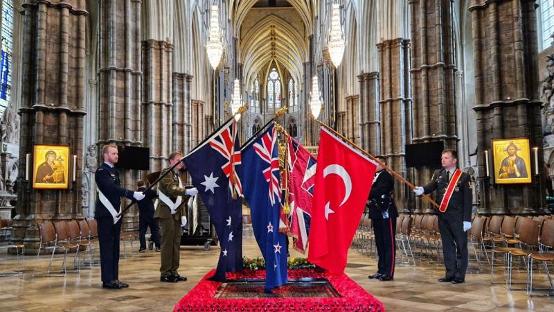 The flags of Australia, New Zealand, the United Kingdom and Turkey over the Grave of the Unknown Warrior in Westminster Abbey following the conclusion of the Anzac Day Memorial Service.