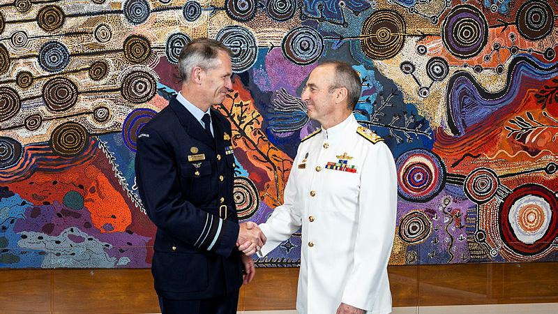 Air Marshal Robert Chipman (left) shakes hands with Vice Admiral David Johnston. Photos: Kym Smith