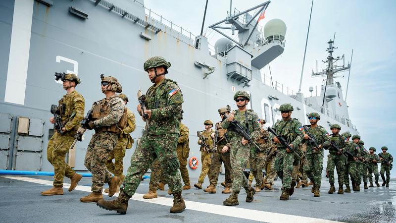 Australian, Philippines and US personnel on board HMAS Canberra.