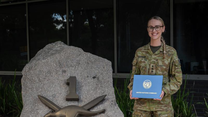 Captain Bronte Franklin with her United Nations Award received during Exercise Freedom Shield, stands outside Headquarters 1st (Australian) Division, Gallipoli Barracks, Brisbane. 