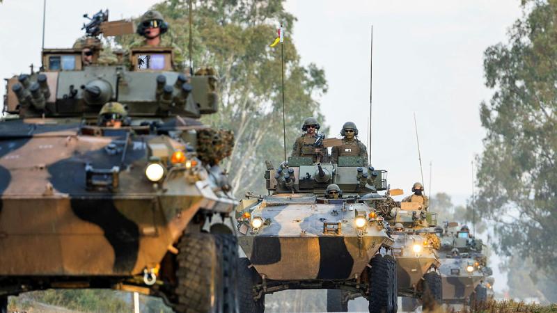 Australian light armoured vehicles drive through the Puckapunyal Military Area, Victoria during the Coral Balmoral Cup.
