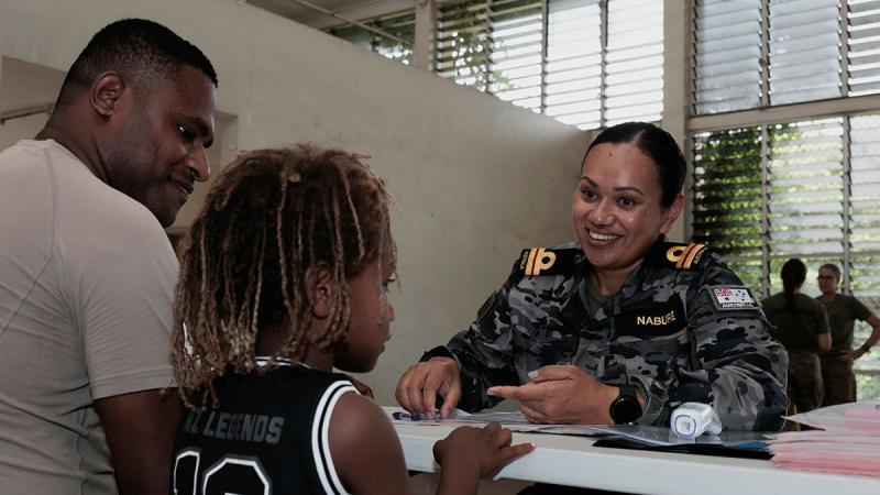 Lieutenant Donna Nabure, from the ADF Malaria and Infectious Diseases Institute team, tests the blood pressure of a PNG Defence Force member at Murray Barracks, PNG. 