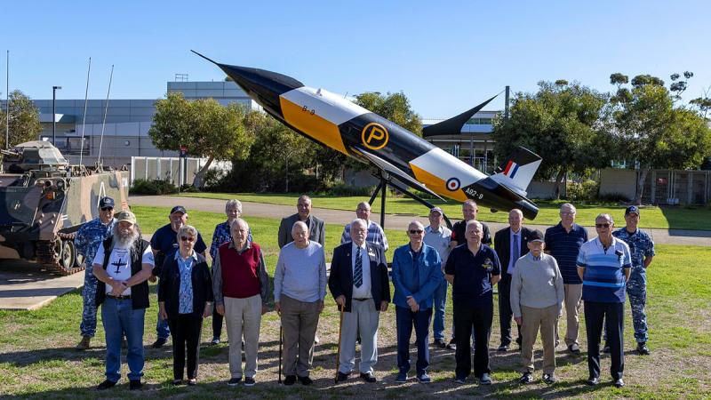 Members from the South Australian branch of the Air Force Association stop for a group photo in front of a Jindivik target drone at the Officers' Mess, during a visit to RAAF Base Edinburgh, South Australia. 
