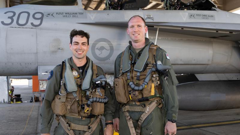 Flight Lieutenant Max (left) and Flight Lieutenant Dallin Stirling, a trainee from 2 Flight Training School before an incentive flight in an EA-18G Growler at RAAF base Pearce during Exercise Centenarie Redimus. 