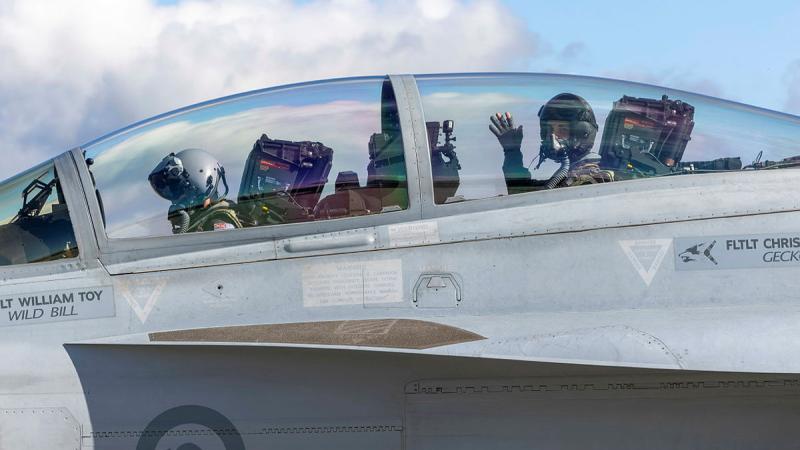 Flight Lieutenant Max and Flying Officer Cooper McClymont prepare to depart RAAF Base East Sale in a RAAF EA-18G Growler during Exercise Centenarie Redimus. 