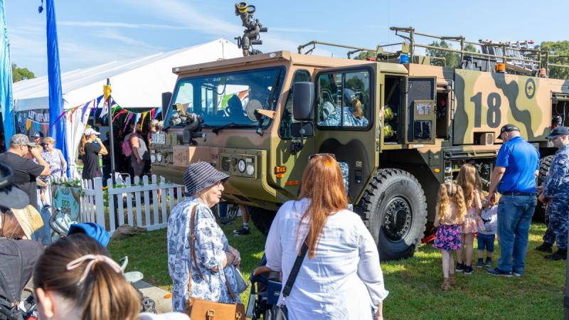 Members of the public inspect the General Purpose Oshkosh Striker Air Transportable fire truck from 22 Squadron during the Hawkesbury Show at Clarendon, NSW.