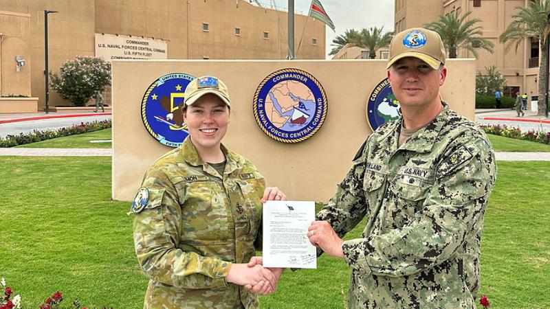 Leading Seaman Maritime Personnel Operator Tahlia Lemon recieves a letter of commendation from Commander of the Combined Maritime Forces and Commander US 5th Fleet, US Navy Vice Admiral George Wikoff while deployed on Operation Manitou.