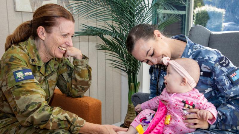 Chaplain Michelle Philp, left, with Corporal Melinda Bridge and her daughter Audrey.
