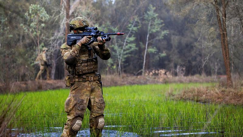 An Australian Army soldier from the School of Infantry conducts an obstacle crossing during a patrol at the Singleton Military Area, NSW. 