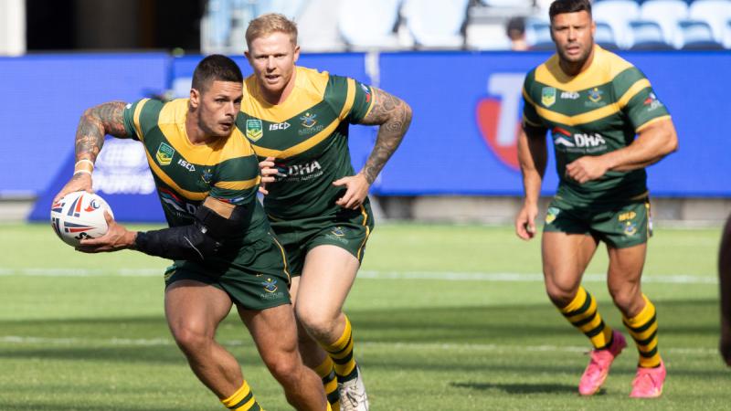 Australian Defence Force Rugby League player Sergeant Joel Munro passes the ball during the ANZAC Day curtain raiser match at Allianz Stadium, Sydney.