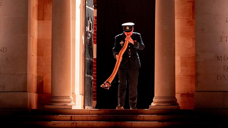 Flight Lieutenant James Evans plays the didgeridoo during the Anzac Day Dawn Service in Villers-Bretonneux, France.