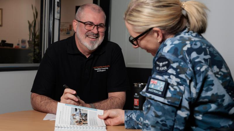 Transition coach Mr Peter Webeck meets with Squadron Leader Nadine Gallaway.