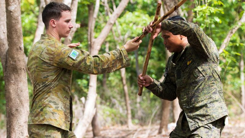 Australian Army soldier, Private Joshua Roberts, is trained in the Filippino martial art of Pekiti-Tirsia Kali by Armed Forces of the Philippines member, Tech Sergeant Rhojimar B. Andres, at Camp Tecson during Exercise Balikatan,