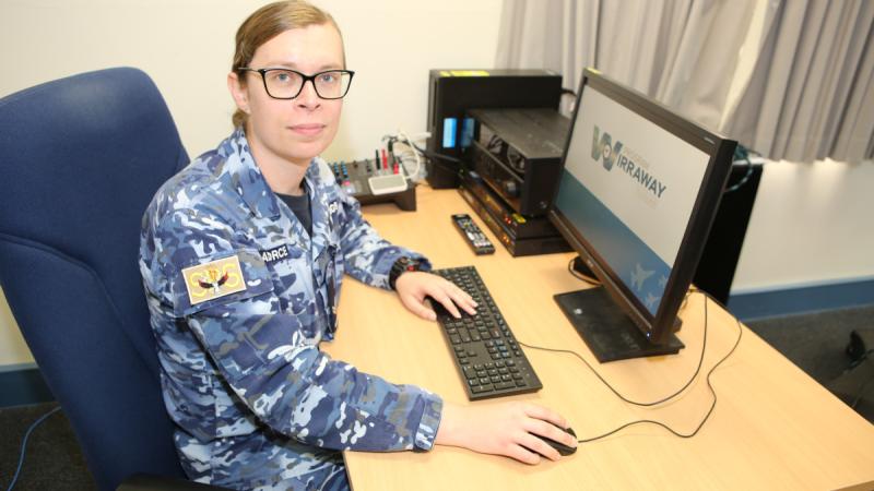 Corporal Gatt Hastings, a professional military education facilitator at the School of Postgraduate Studies, prepares to deliver her next lesson.