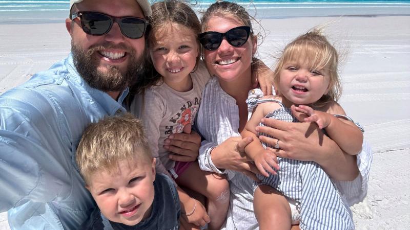 Chief Petty Officer Joshua Scanlon, with his fiancé Kate Barry and their three children, Jonty, Leila and Tillie, enjoying a family holiday. 