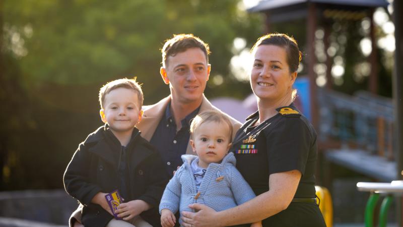 Navy officer Commander Alicia Harrison and husband Mitch with their children Harrison and Oliver, in Canberra. 